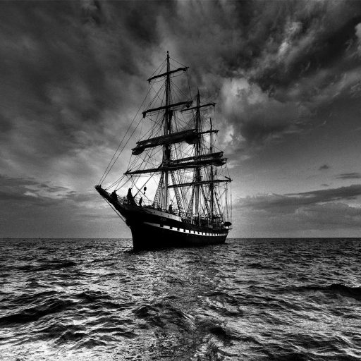 black and white photo of a tall ship